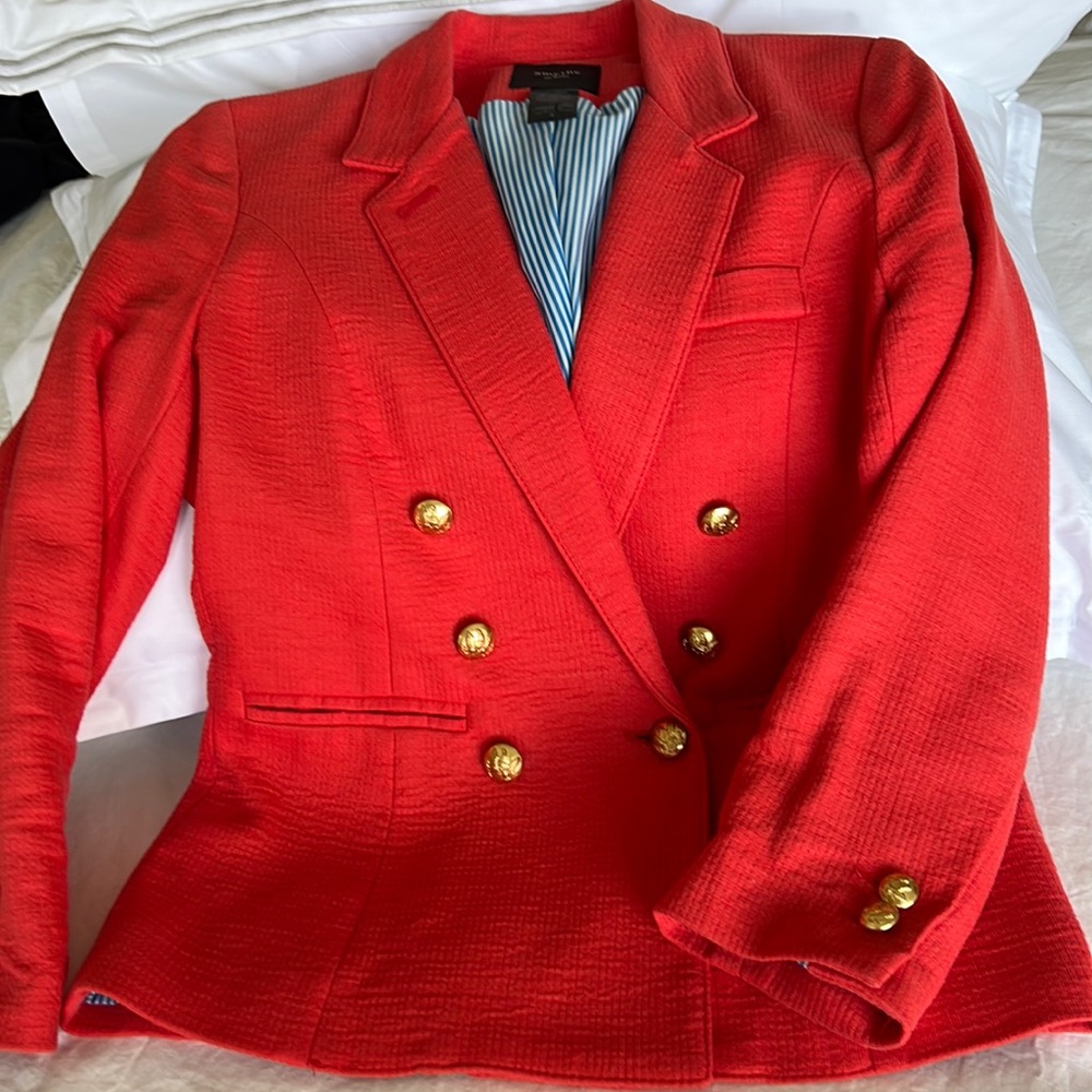 Smythe Women’s Short Jacket made in Canada. Color: Coral.